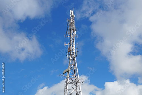 Telecommunication tower with antennas blue sky