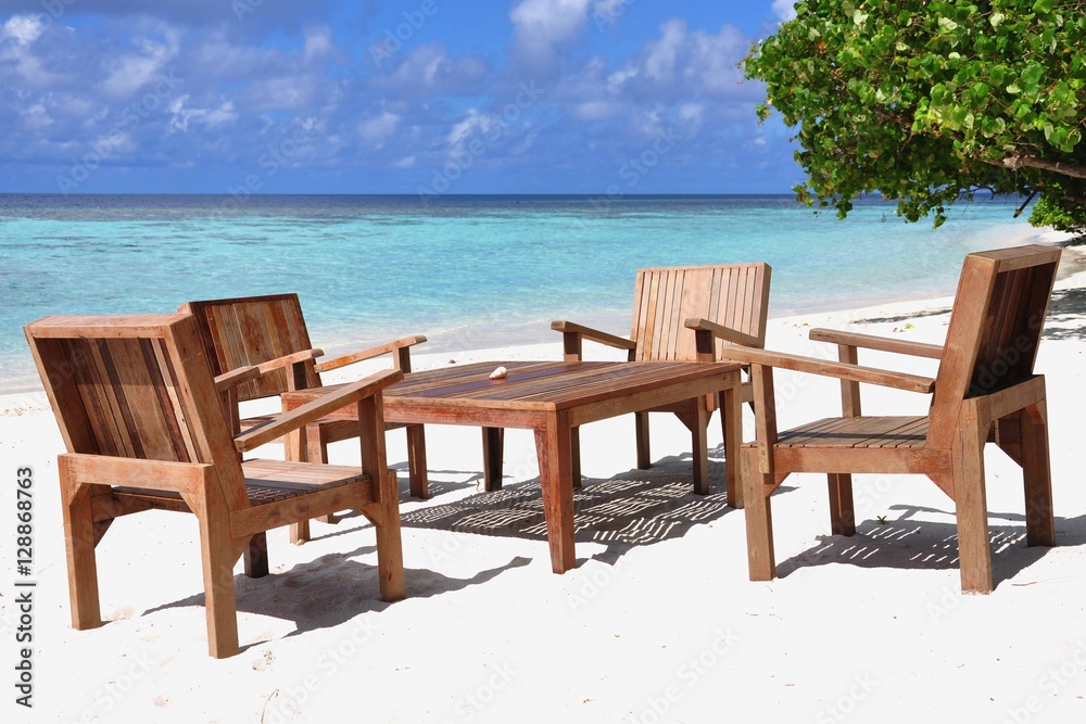 Table and chairs at tropical beach restaurant, Thinadhoo island, Vaavu atoll, Maldives