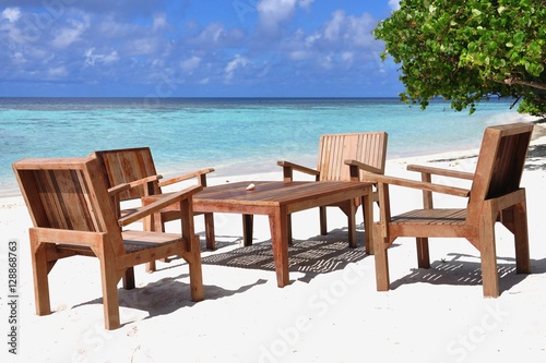 Table and chairs at tropical beach restaurant  Thinadhoo island  Vaavu atoll  Maldives