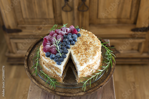 Gluten free Vanilla and Chocolate layered Cake with raspberries and blueberries