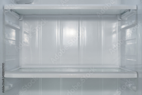 Empty open fridge with shelves, refrigerator.
