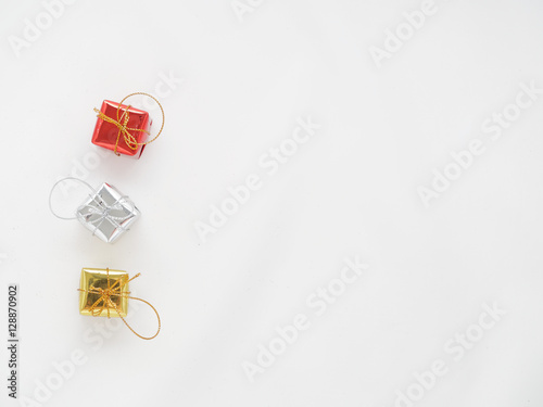Red, silver, and gold gift boxes on isolated white background