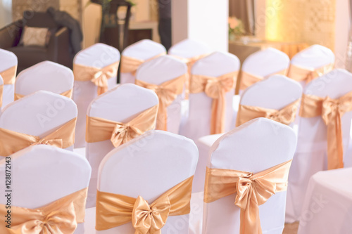 beautiful chairs decoration with ribbon in wedding event hall,se