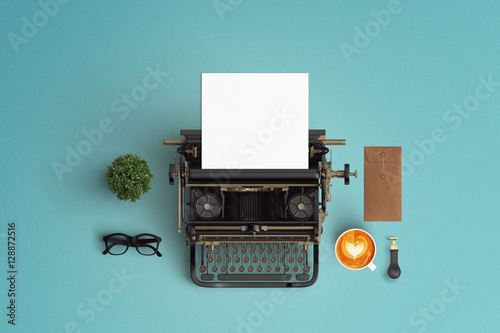  vintage typewriter paper and cup of coffee latte art on the col photo