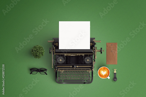  vintage typewriter paper and cup of coffee latte art on the col