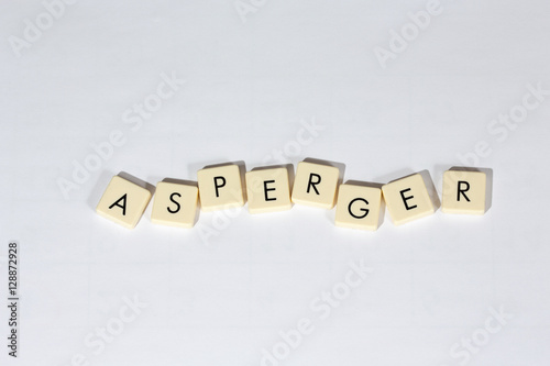 Obraz na płótnie Asperger text on a white surface. Asperger Syndrome is a neurobiological disorder on the higher-functioning end of the autism spectrum. w salonie