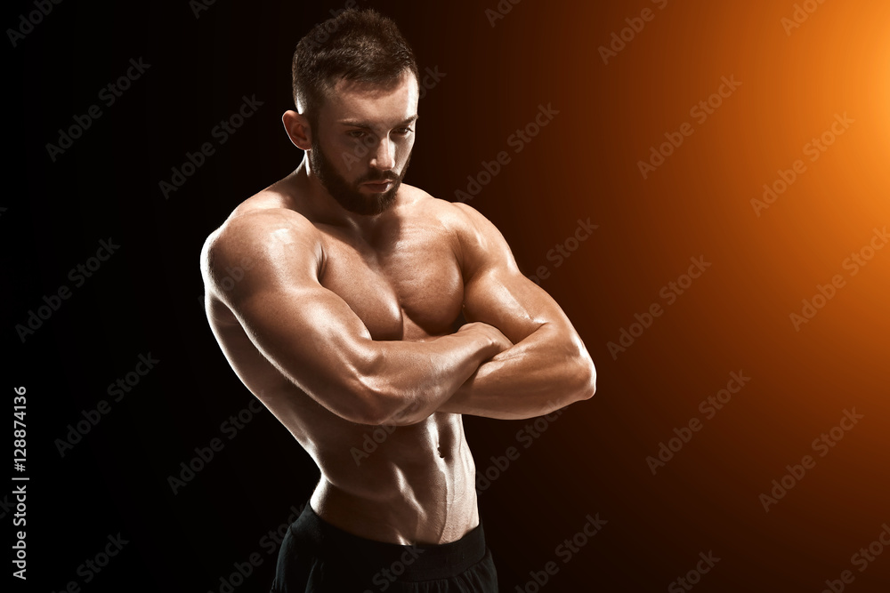 Muscular bodybuilder guy doing posing