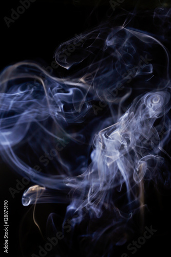 White smoke movement on black background.