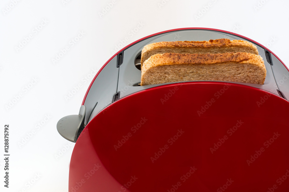 Fototapeta premium Toaster with toasted bread isolated on white background, Kitchen equipment. Close up. Side view
