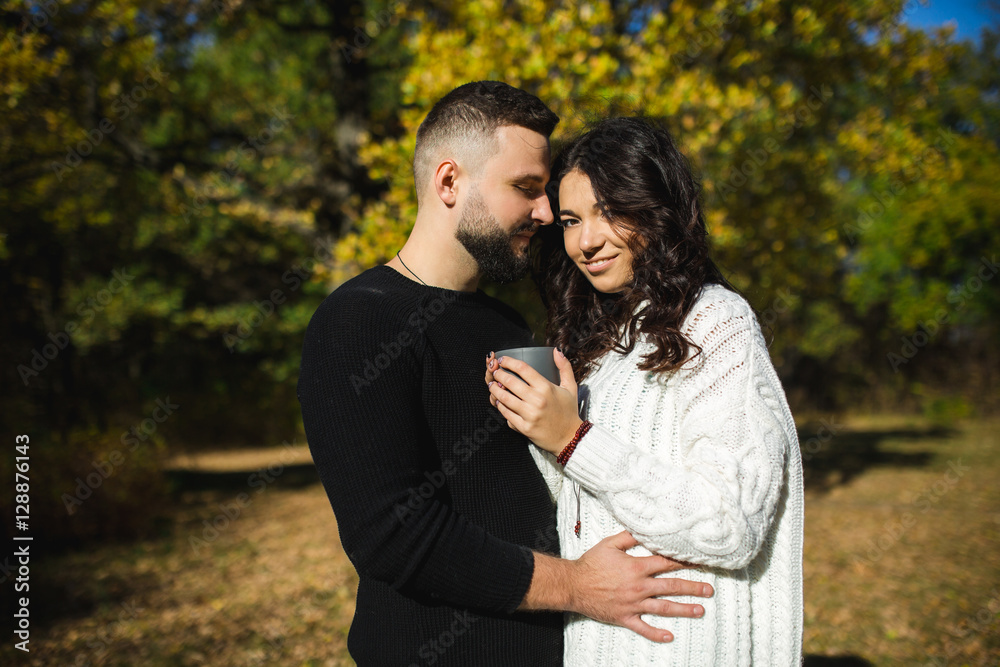 Fototapeta premium Couple in love - Beginning of a Love Story. A man and a girl on the nature while walking
