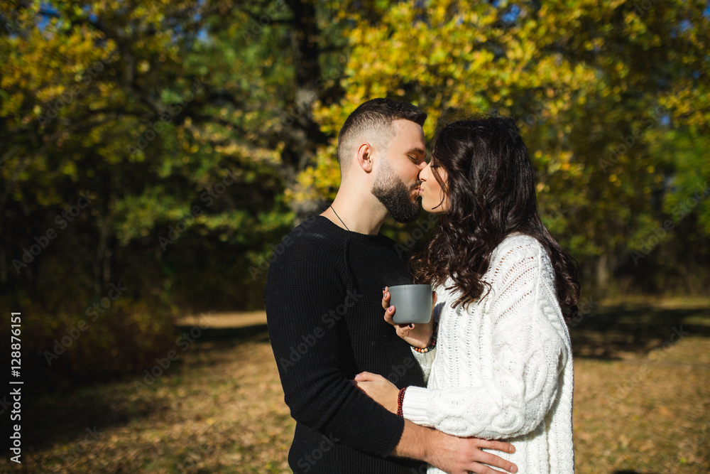 Couple in love - Beginning of a Love Story. A man and a girl on the nature while walking Couple in love - Beginning of a Love Story. A man and a girl on the nature while walking
