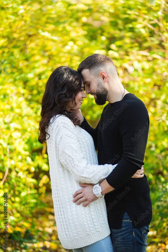 Couple in love - Beginning of a Love Story. A man and a girl on the nature while walking Couple in love - Beginning of a Love Story. A man and a girl on the nature while walking