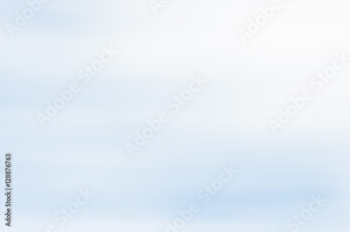 Blurred abstract background. Pale blue and white.