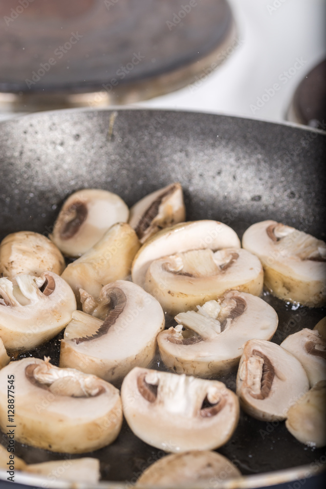 Frying sliced mushrooms in the frying pan Frying sliced mushrooms in the frying pan