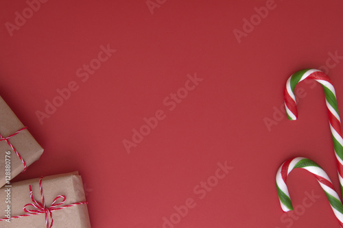 Christmas background with Xmas gifts and candy canes. Top view, flat lay. Copy space for text