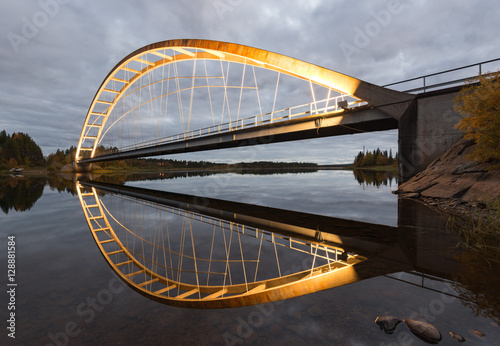Fototapeta Naklejka Na Ścianę i Meble -  Illuminated Bridge after Sunset, Swedish Lapland