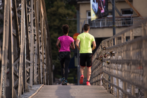 multiethnic couple jogging in the city