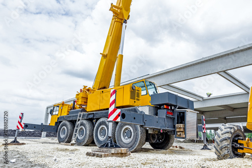 Bild auf Leinwand Low angle view on big crane's wheels, undercarriage