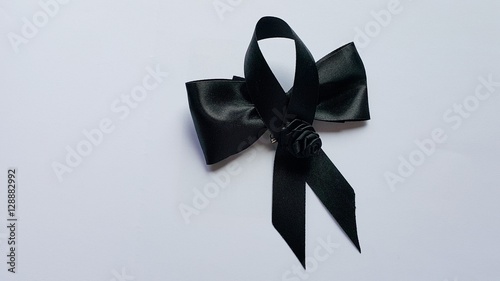 Two black bow stack on the white floor.