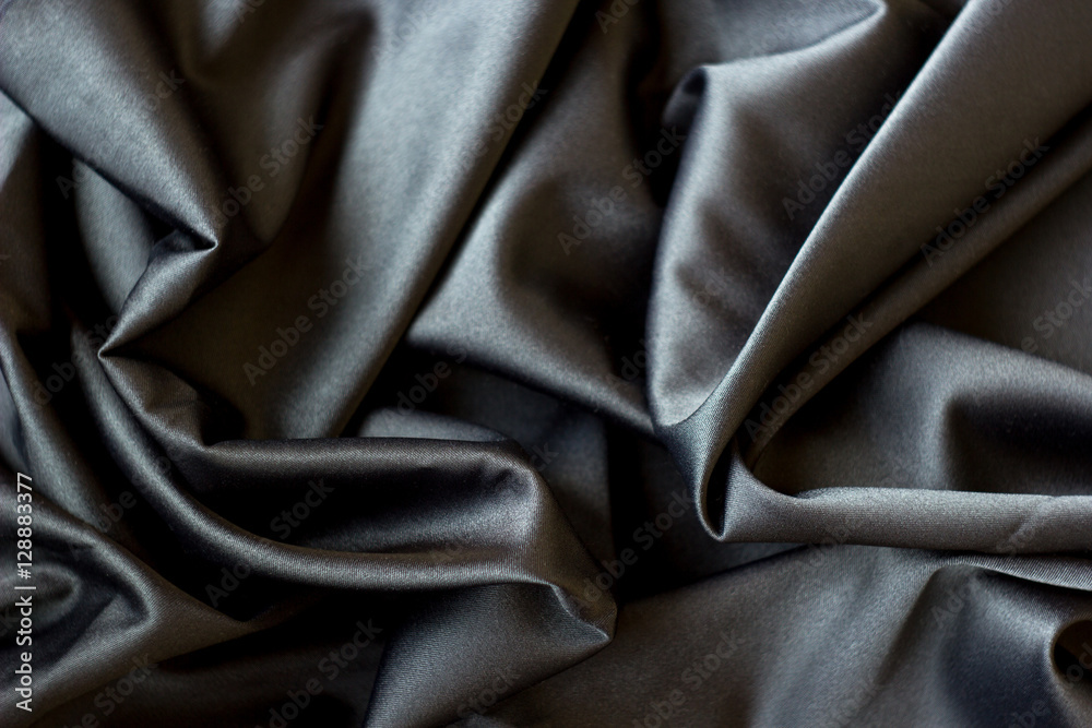 Obraz premium Black abstract background luxury cloth or liquid wave or wavy folds, silk or satin material with waving lines