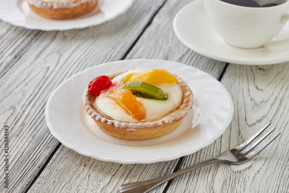Tartlets with cream and fruits, orange, kiwi, cherry Tartlets with cream and fruits, orange, kiwi, cherry