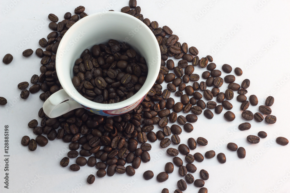 Close up coffee beans and and paper on with table Close up coffee beans and and paper on with table