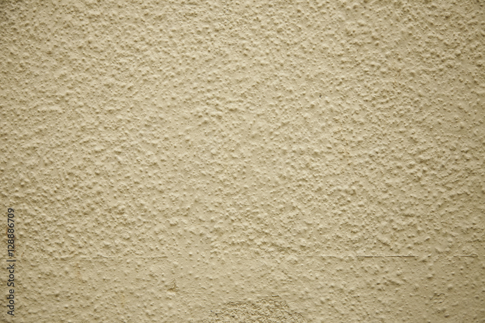 A full page of cream rendered wall background texture A full page of cream rendered wall background texture