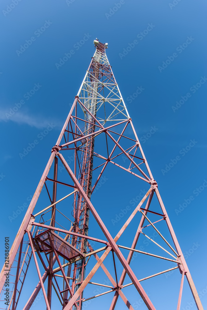 telephone tower against a blue sky 