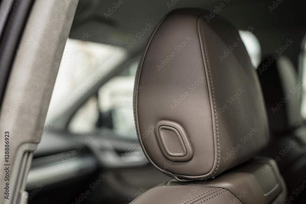 Modern car leather headrest. Interior detail.