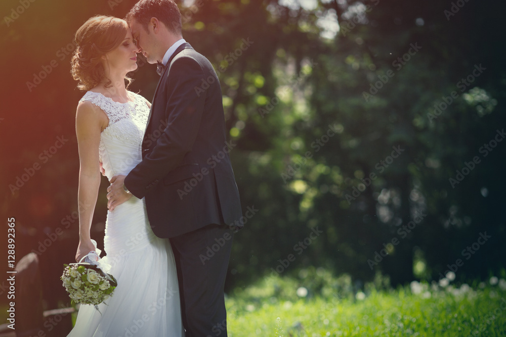 Beautiful bride and groom outdoors Beautiful bride and groom outdoors