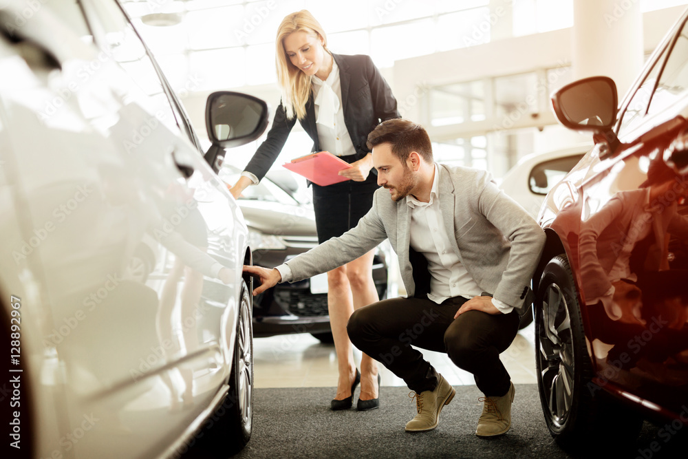 Professional salesperson selling cars Professional salesperson selling cars