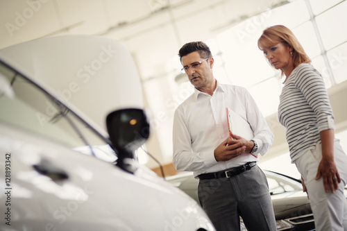 Professional salesperson selling cars