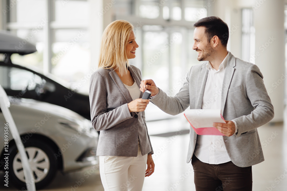 Professional salesperson selling cars Professional salesperson selling cars