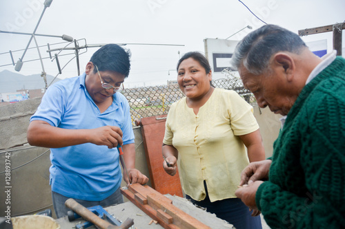 Latin people working with wood