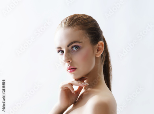 Beauty portrait of a young woman on white