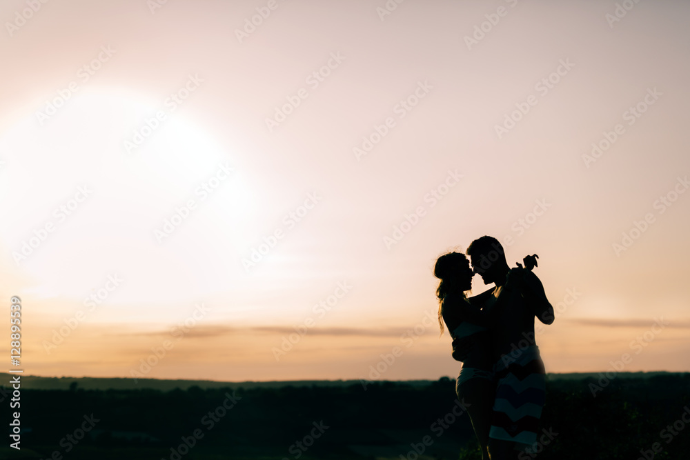 Couple dancing during sunset