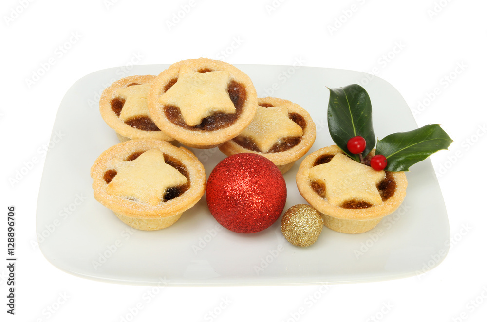 Mince pies on a plate with decorations