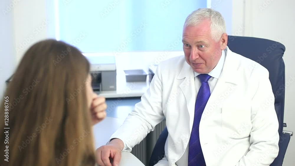 Woman consulting plastic surgeon before nose reshaping procedure at beauty clinic. Cosmetic surgeon consultation for rhinoplasty. Nose job, augmentation. Woman consulting plastic surgeon before nose reshaping procedure at beauty clinic. Cosmetic surgeon consultation for rhinoplasty. Nose job, augmentation.