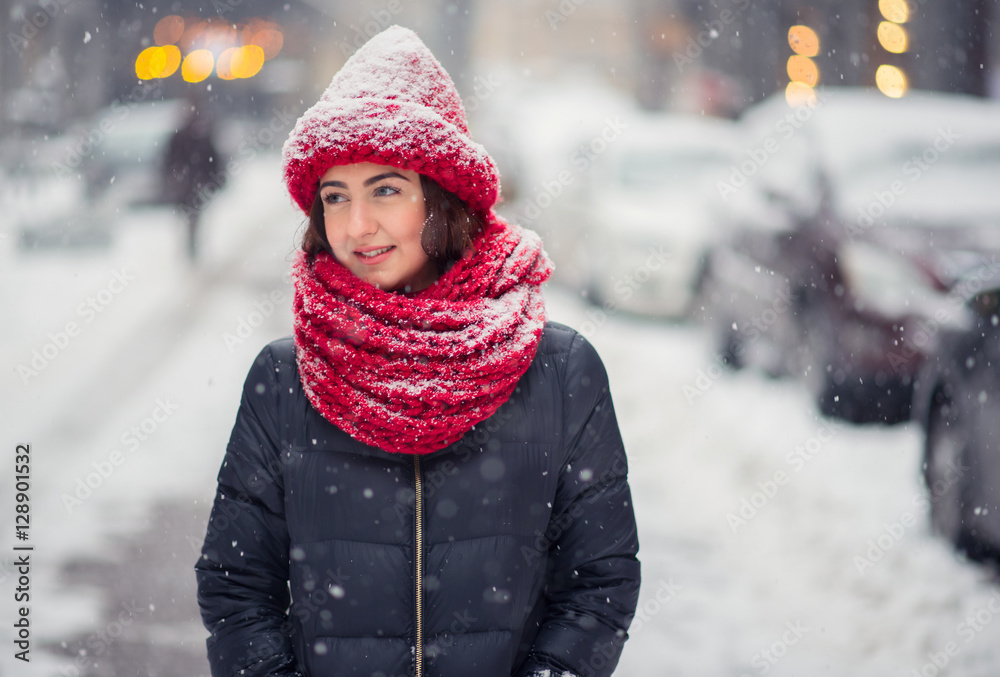 Girl standing in the street and it is snowing Girl standing in the street and it is snowing