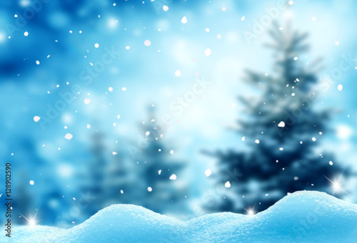 Christmas winter background with snow and blurred bokeh © Lilya