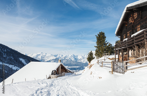 Wooden cabins in the Austrian Alps in the snow