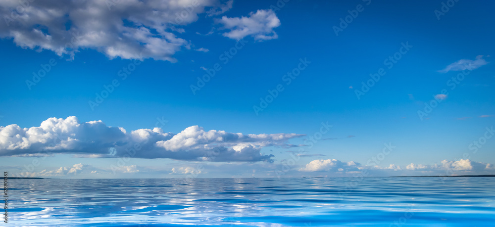 View of horizon line with summer sky and blue ocean