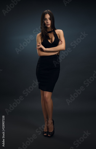 Sexy girl in black skin-tight dress