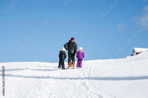 man with kids in winter time