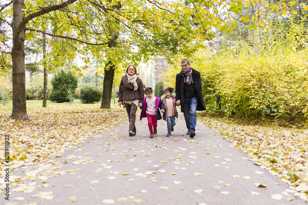 Grandparents with grandchildren in autumn park Grandparents with grandchildren in autumn park