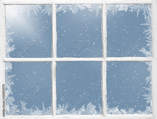frosty border on weathered windowpane with snowflakes