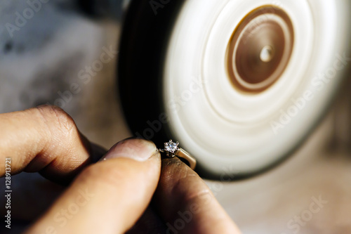 Jeweler polishing jewelry