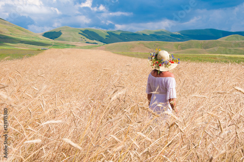 Girl wearing White dress in a wheat field