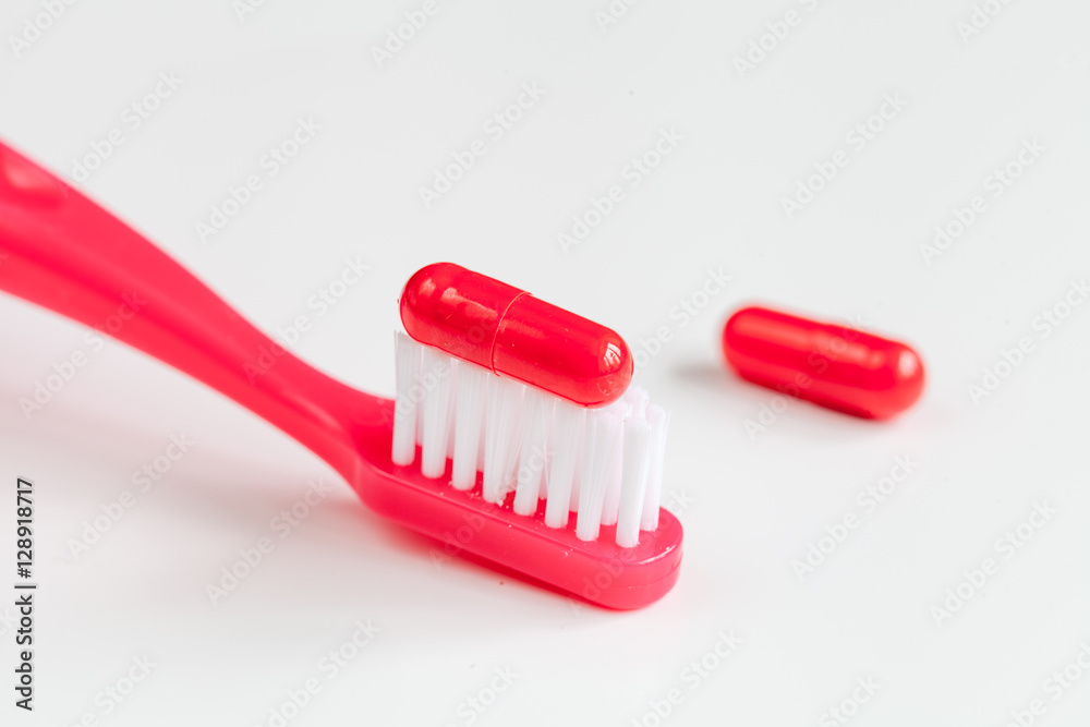 concept toothache with toothbrush and tablet at white background concept toothache with toothbrush and tablet at white background