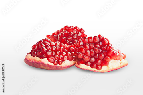 ripe red pomegranate isolated on white background